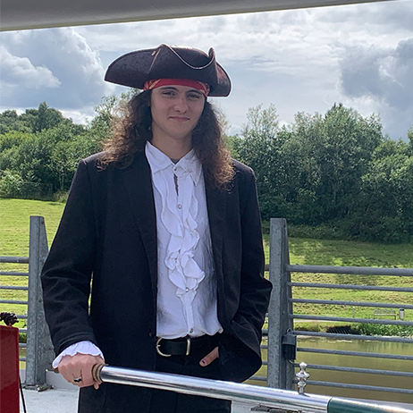 Me, dressed as a pirate, on the deck of a riverboat in Falkirk, Scotland (2022)